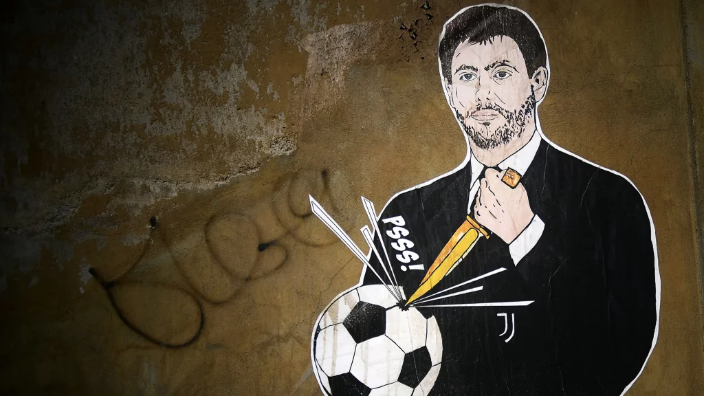 نقاشی دیواری از آنیلی در حال چاقو زدن به توپ فوتبال